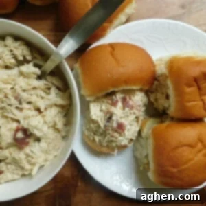 Shredded Chicken Sliders on white plate.
