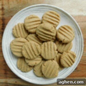 Bite-Sized Peanut Butter Cookies 2 baked mini peanut butter cookies on a plate
