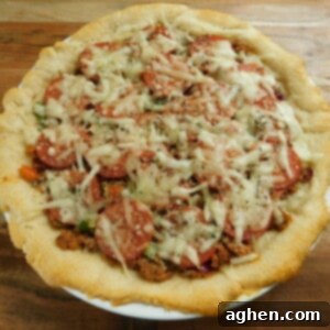 Guilt Free Meat Lovers Pizza 2 A top-down view of the baked Weight Watchers turkey pizza pie with a delicious golden crust.