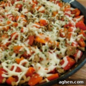 One-Pan Turkey and Peppers 2 Ground Turkey and Peppers Skillet with melted cheese and fresh parsley.