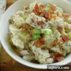 Loaded Parmesan Bacon Ranch Potato Salad 2 Parmesan Bacon Ranch Potato Salad, garnished with fresh green onions