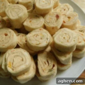 Dreamy Cream Cheese Pinwheels 2 cream cheese roll up on white plate