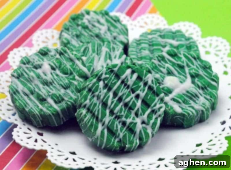 St. Patrick's Day Oreos 3 St. Patrick's Day Oreos covered in green chocolate and a white drizzle.