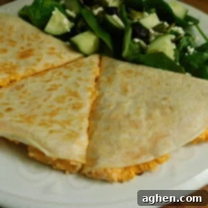 Zesty Buffalo Chicken Quesadillas 2 Buffalo Chicken Quesadilla on white plate, perfect for a quick meal