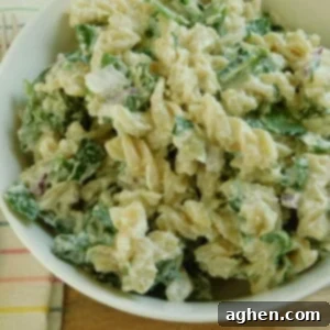 Spinach and Artichoke Pasta Salad in a square bowl