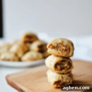 Turkey Sausage Rolls 9 sausage rolls stacked on cutting board