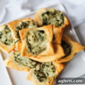 spinach artichoke crescent rolls on white plate