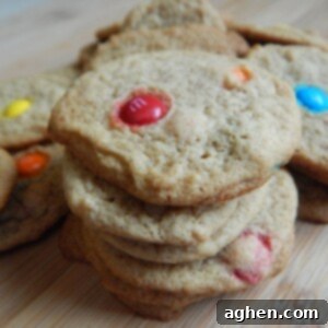 A plate of colorful mini M&M cookies, perfect for a quick snack.