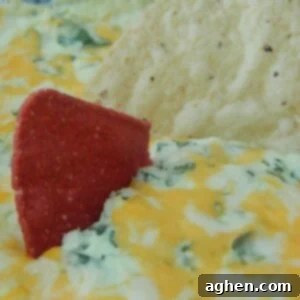 Irresistible Hot Cheesy Spinach Dip 2 Close-up of baked hot cheesy spinach dip