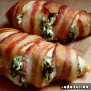A perfectly cooked, bacon-wrapped chicken breast, showcasing its crispy exterior.