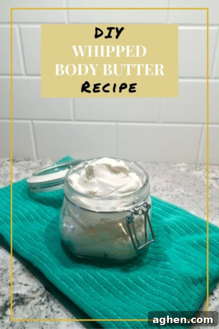 A beautifully textured DIY Whipped Body Butter in a clear glass jar, ready for use, emphasizing its fluffy and soft appearance.