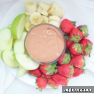 Luscious Peanut Butter Chocolate Fruit Dip 2 A top-down view of the creamy chocolate peanut butter fruit dip in a small white bowl.