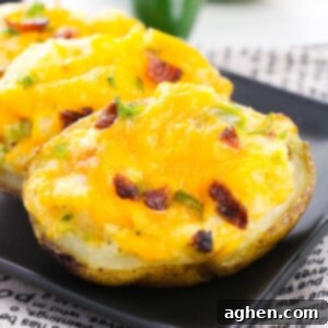 A perfectly golden-baked loaded potato with melted cheese and jalapeño on top.