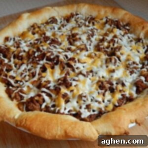 Ultimate Taco Pie 2 A delicious taco pie, baked to golden perfection and ready for serving