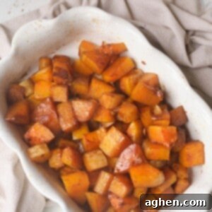 Sweet and Spicy Roasted Butternut Squash 2 roasted squash in white casserole dish