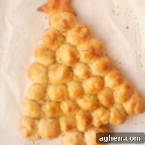 christmas tree pull apart bread on white parchment paper