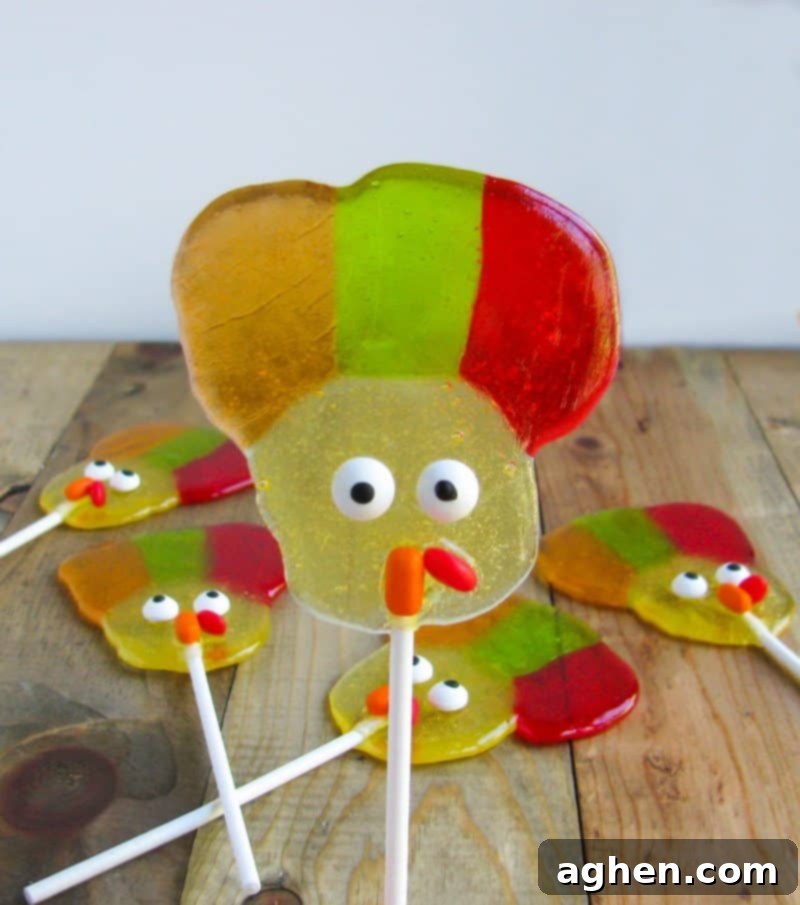 Turkey shaped lollipops with candy eyes, orange tic tac nose, and red hot wattle.