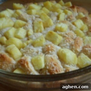 Tropical Sunrise Pie 2 Close up of a pineapple coconut breakfast pie with golden crust