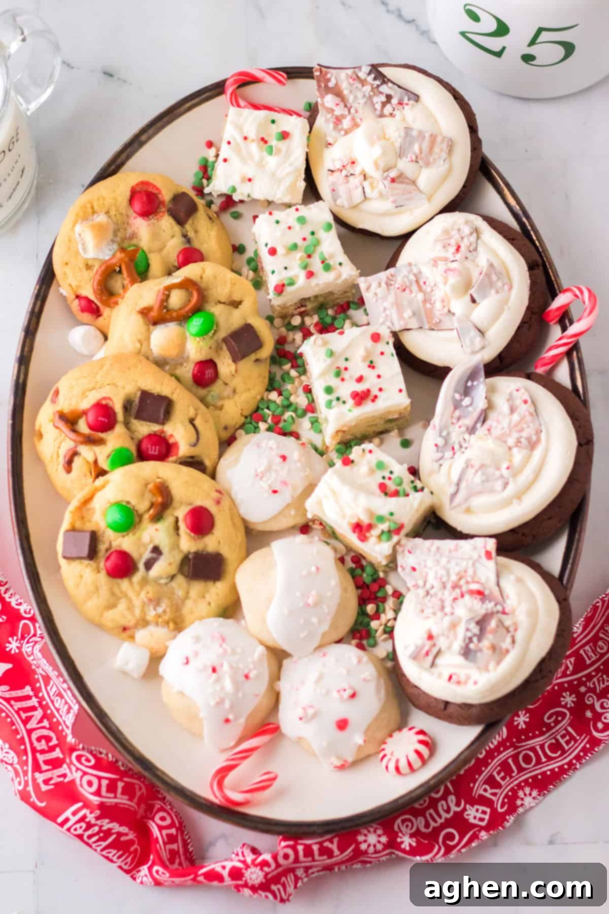 Christmas cookie exchange cookies on a platter including: peppermint bark cookies, frosted sugar cookies, Christmas kitchen sink cookies, and peppermint meltaways.