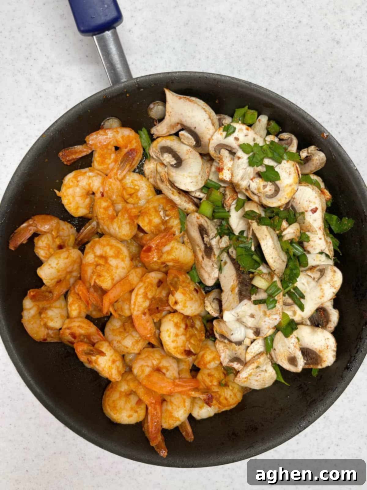 cooked chipotle shrimp and veggies in a skillet