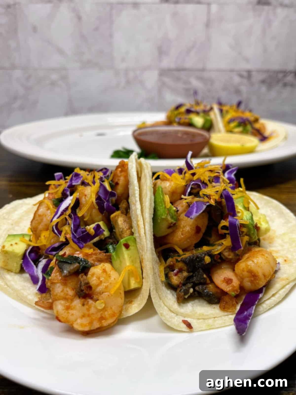 two chipotle shrimp tacos close up