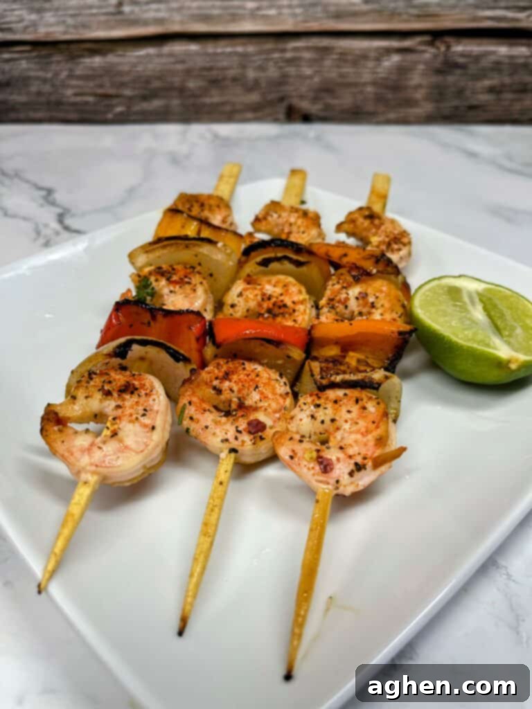 Grilled shrimp and colorful vegetables on skewers