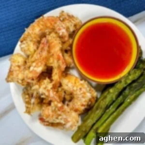 cooked coconut shrimp and asparagus