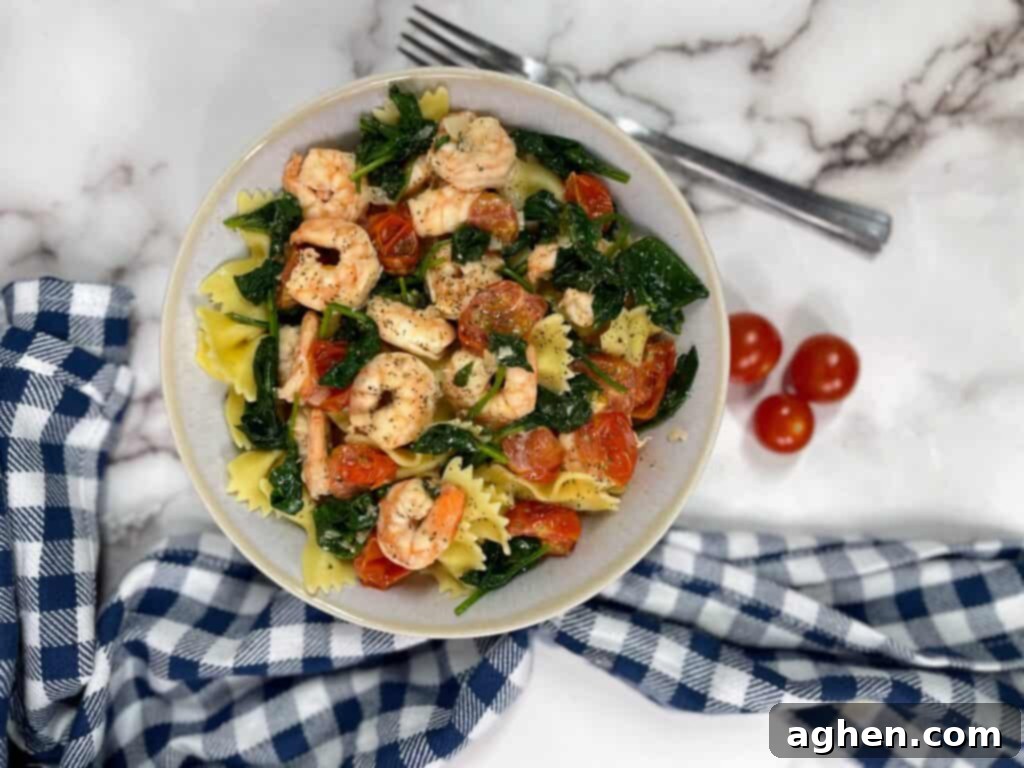 Finished plate of creamy shrimp pasta with spinach