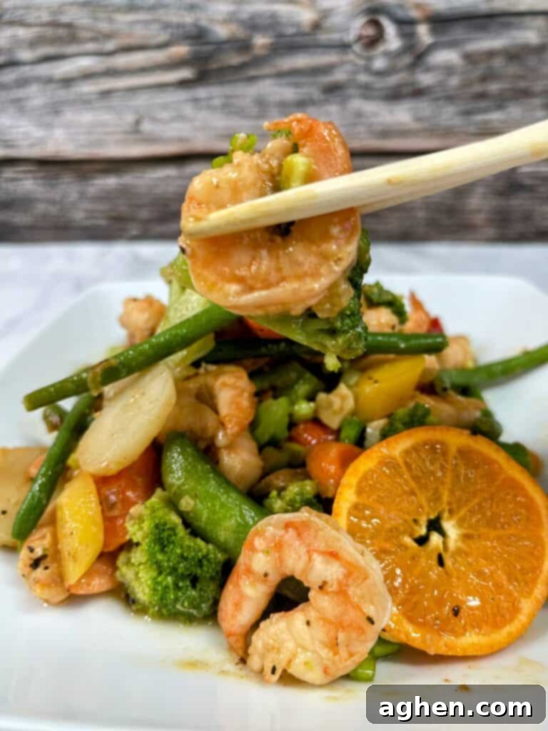 Shrimp stir-fry with chop sticks in a bowl