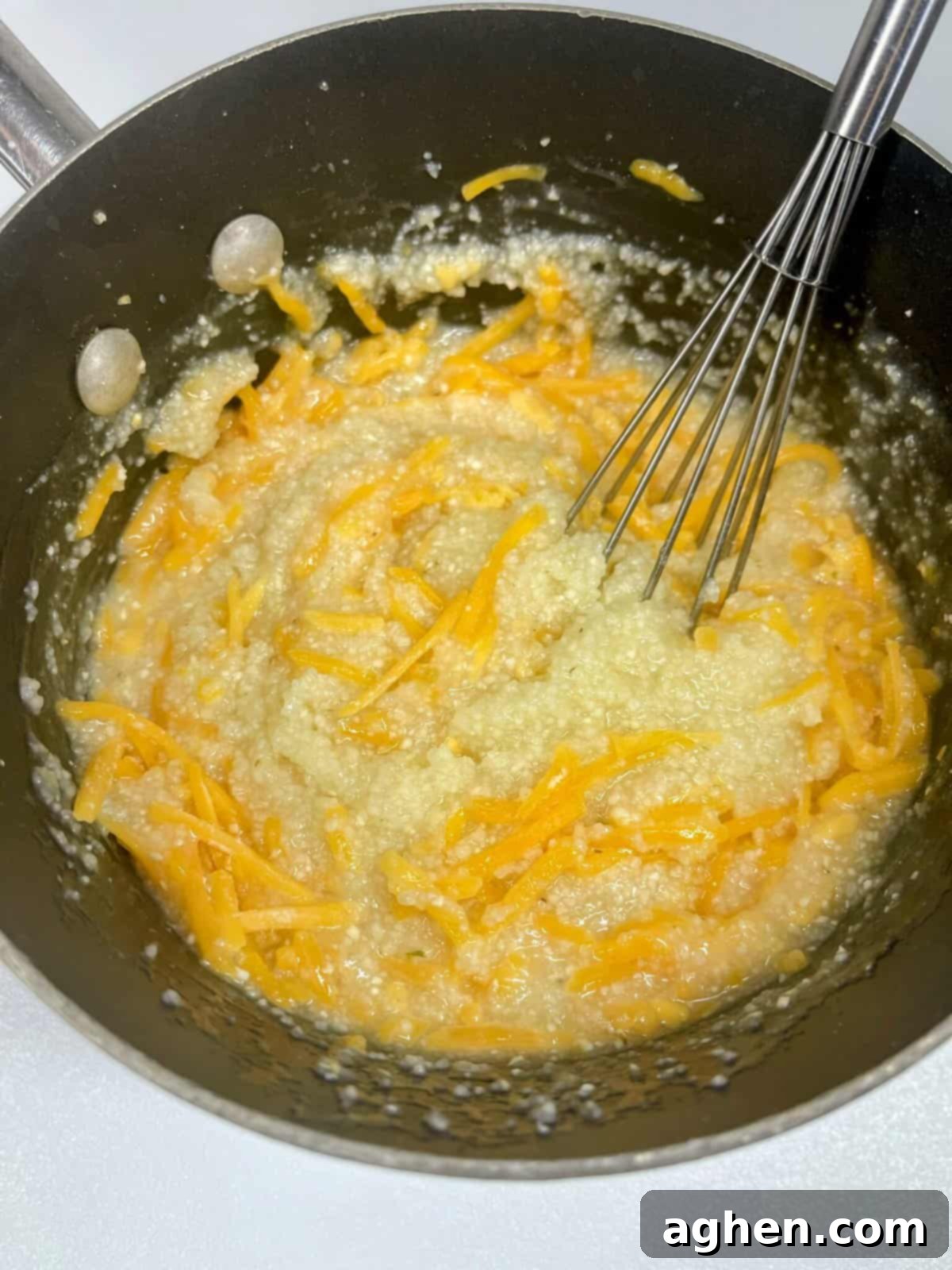 Guilt-Free Southern Delight Weight Watchers Shrimp and Grits 5 Cooked grits with cheese in a pot