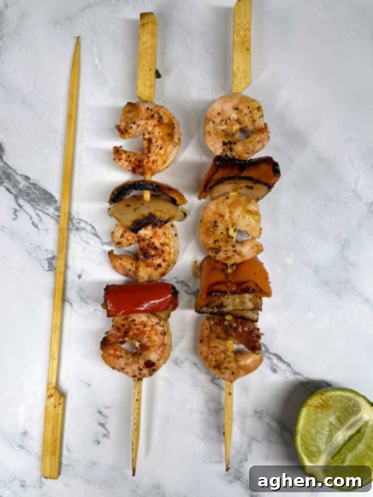 two cooked shrimp skewers