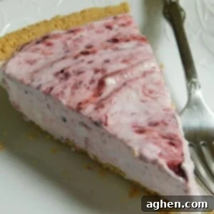weight watchers friendly berry cheesecake with fork on white plate