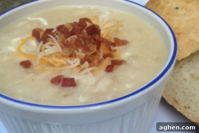 bowl of cream potato and cauliflower cheesy soup