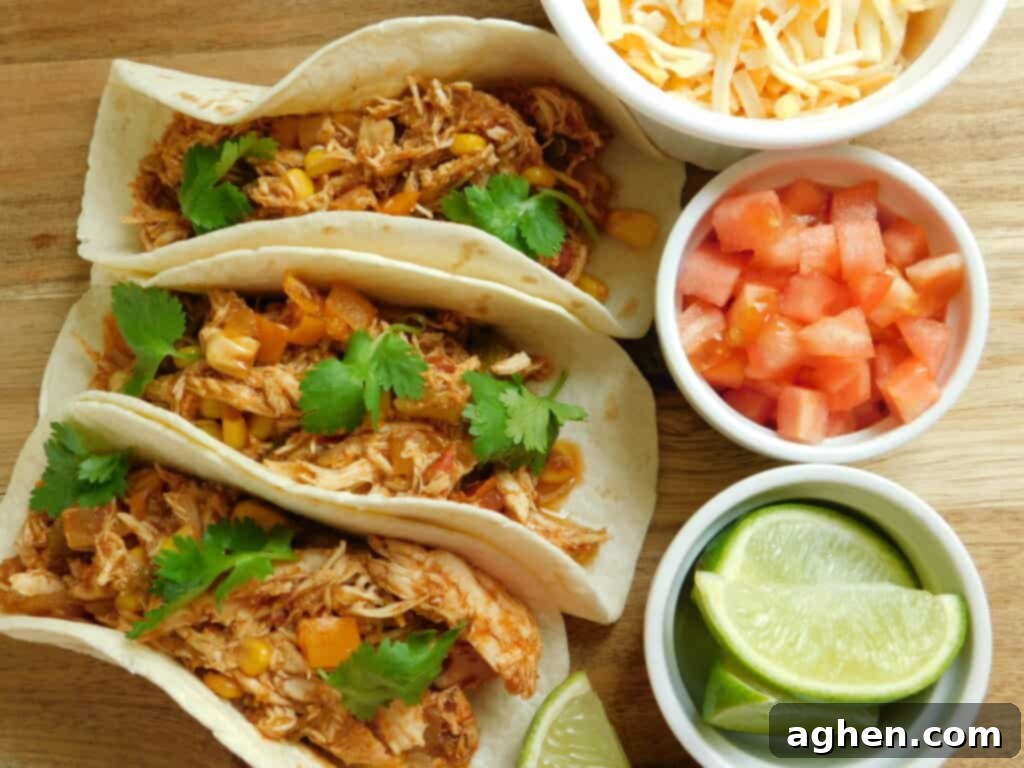three southwest chicken tacos with toppings