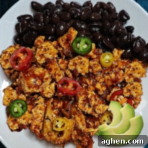 Close-up of a bowl of cooked Chipotle-style Sofritas with fresh cilantro garnish, ready to be served in a delicious vegan meal