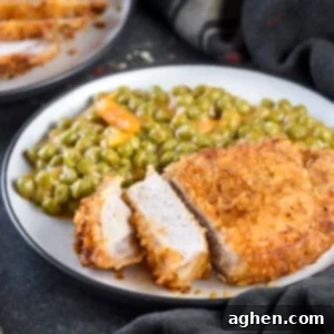 Air Fryer Shake N Bake Pork Chops sliced on a plate