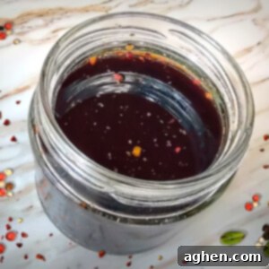 Vegan Worcestershire Sauce in jar on white counter