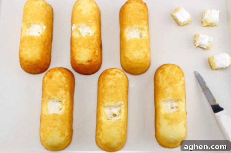 6 Twinkies with squares cut out of the top to place Peeps.