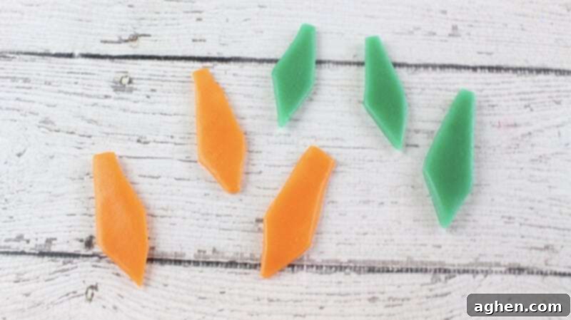 Orange and green tie shapes cut out of airhead candy.