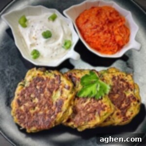 Finished air fryer zucchini fritters with dipping sauce