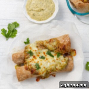 WW Chicken Enchiladas 2 weight watchers chicken enchiladas on white plate