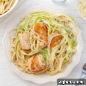 Salmon Alfredo on white plate