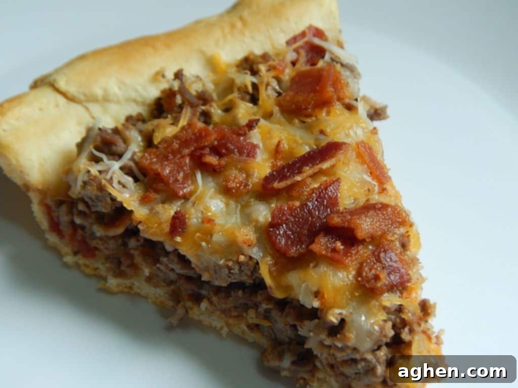The full Impossible Cheeseburger Pie with one slice removed, showcasing the delicious filling