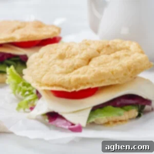 Simple 3 Ingredient Cloud Bread 2 A perfectly baked cloud bread sandwich on white butcher paper, showcasing its fluffy texture.
