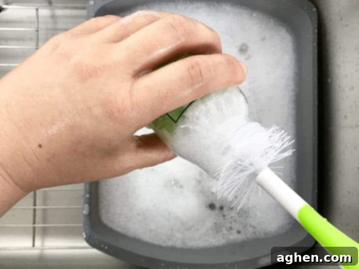 Washing Bottle With Bottle Brush. over dish pan