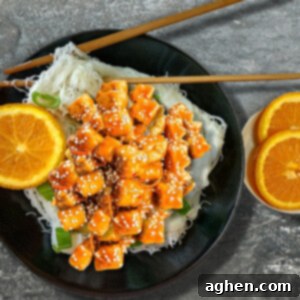 Sweet and Tangy Orange Tofu 2 orange tofu in black bowl