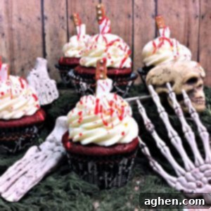 Bloody cupcakes: Red velvet cupcakes with cream cheese frosting and blood splatter, perfect for a gruesome Halloween treat.