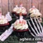 Bloody cupcakes: Red velvet cupcakes with cream cheese frosting and blood splatter, perfect for a gruesome Halloween treat.