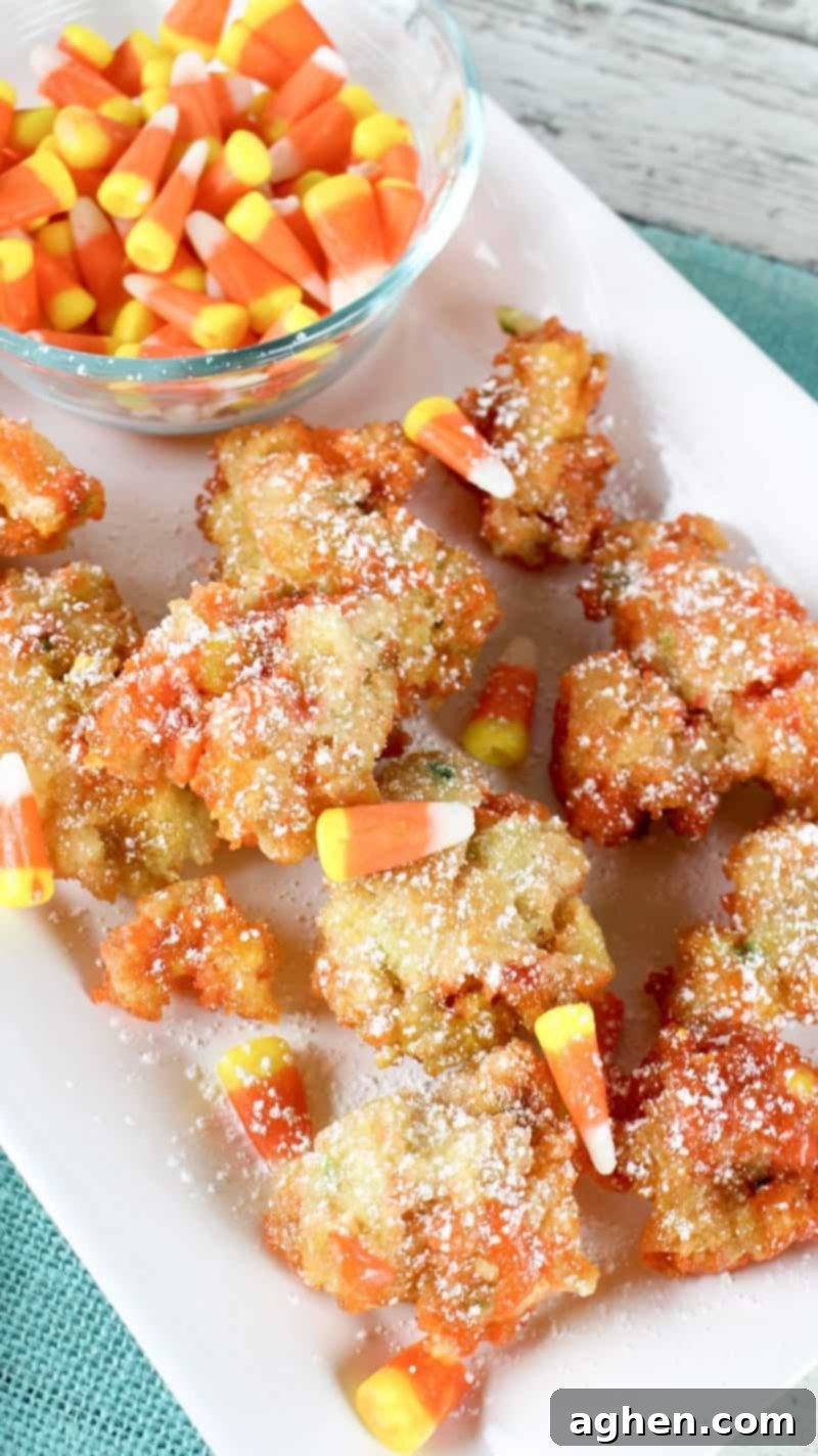 Funfetti Fried Candy Corn Bites 3 Funfetti fried candy corn fritters dusted with powdered sugar.