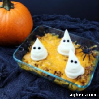 A festive Halloween Shepherd's Pie topped with mashed potato ghosts.